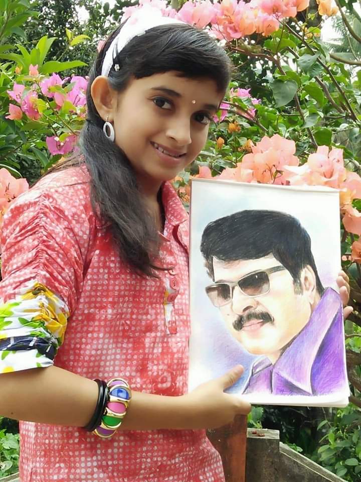 Rosemaria Sebastian with Painting of Mammookka